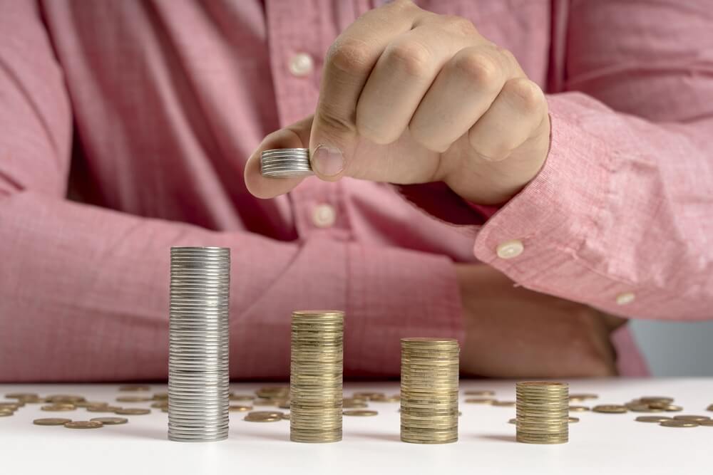 Coin stacks representing different pricing tiers