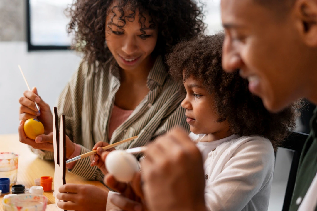 Participants paint eggs in a hands-on art workshop during a cultural tour.